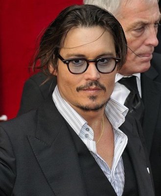 Johnny Depp a ajuns la o înţelegere pentru evitarea unui proces şi va încasa o sumă ''din opt cifre''